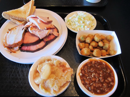 Three meat dinner with pork tenderloin, ham, and turkey