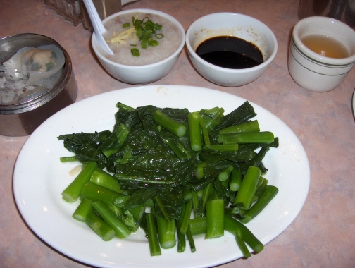 Chinese broccoli, steamed shrimp and leek dumplings, and congee served as dim sum